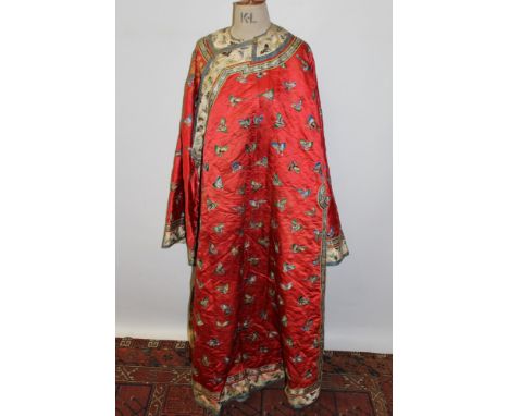 19th century Chinese robe, padded red silk ground with allover embroidered butterflies, front opening, wide sleeves with slee