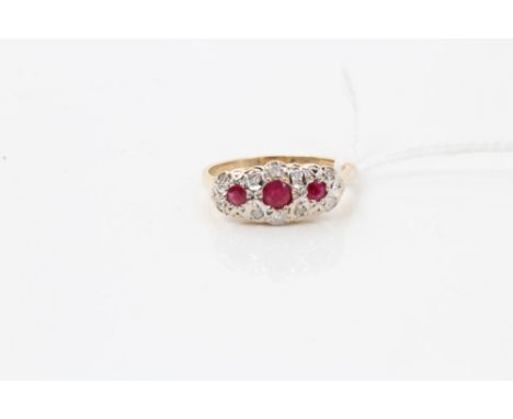 Gold (14ct) ruby and diamond ring with three round mixed cut rubies surrounded by borders of single cut diamonds.  Ring size 