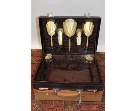 Ladies' 1930s fitted travelling / vanity case - brown leather with canvas protective cover, containing accessories, with pale