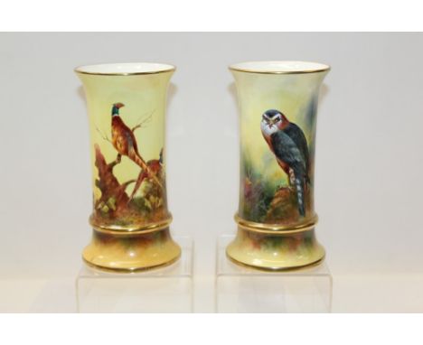 Pair of good quality limited edition Coalport vases with hand-painted pheasant and bird of prey decoration, signed by R. Budd