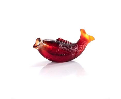 A CHINESE CARVED GARNET GLASS ‘FISH’ SNUFF BOTTLE carved in the form of a fish with incised scales, the raised bifurcated tai