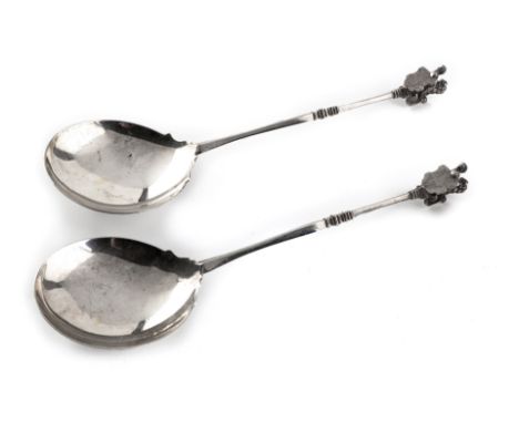 A PAIR OF DUTCH SILVER SPOONS each with a shaped bowl, the stem surmounted with a lion finial and embossed crest 90g (2)