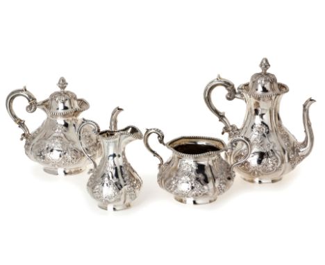 A VICTORIAN IRISH FOUR-PIECE SILVER TEA SERVICE, JOHN SMITH, DUBLIN 1860 AND 1863 comprising: a teapot, coffee pot, sugar bas