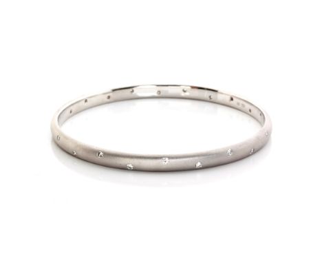 A STARLIGHT DIAMOND BANGLE the continuous band interspersed with 22 round swiss-set brilliant-cut diamonds, weighing approxim
