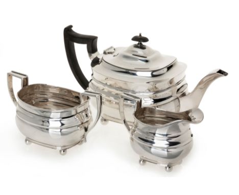 A GEORGE V THREE-PIECE SILVER TEA SERVICE, WILIAM HUTTON AND SONS, SHEFFIELD, 1930 AND 1931 comprising: a teapot, milk jug an