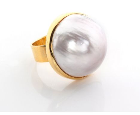 A MABÉ PEARL RING the silver white pearl measuring 22mm by 14mm, in 18ct gold, ring size M¼ 