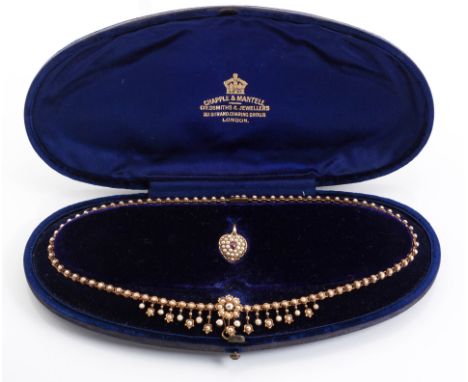 A VICTORIAN SEED PEARL PENDANT NECKLACE, CHAPPLE &amp; MANTELL, LONDON the heart-shaped pendant centred by a claw-set pear mi