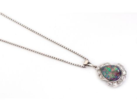 A BLACK OPAL AND DIAMOND PENDANT the tube-set pear-shaped opal surrounded by 12 pavé-set round brilliant-cut diamonds, weighi