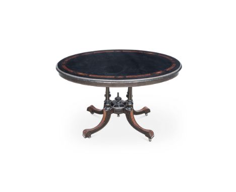 A VICTORIAN EBONISED AND INLAID CENTRE TABLE the moulded oval top above a plain frieze, on four fluted turned tapering suppor