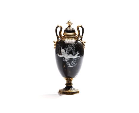 A MINTONS PATE-SUR-PATE TWIN HANDLED VASE AND COVER, ATTRIBUTED TO L. SOLON (1835 – 1913) the baluster-shaped body decorated 