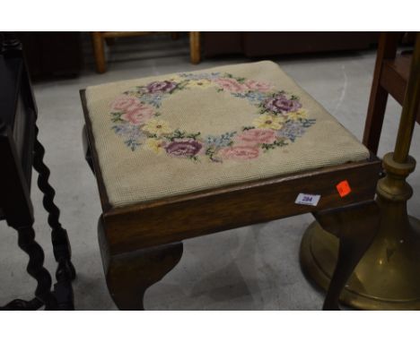 A Queen Anne style tapestry footstool