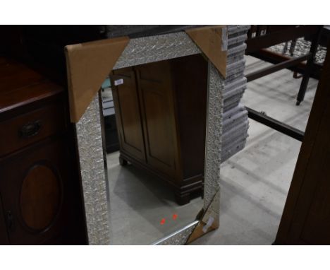 A modern wall mirror , starfish effect, still with packaging, approx 78 x 109cm