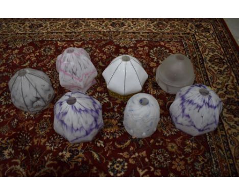 A box of vintage opaque glass light shades