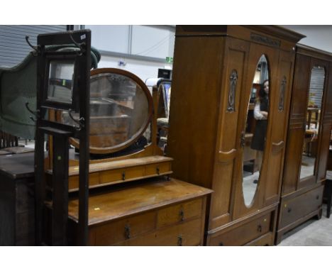 An Art Nouveau period golden oak mirror door wardrobe and dressing table