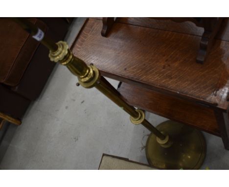 A vintage brass standard lamp