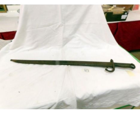 A 19th century bayonet in metal scabbard