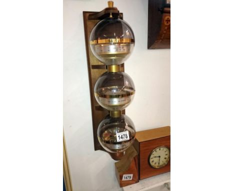 A 3 ball aneroid barometer, hydrometer, thermometer