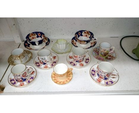 A quantity of porcelain cups and saucers including Worcester, Royal Albert etc