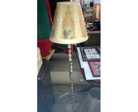 An onyx and gilt standard lamp with 2 shades
