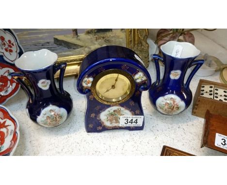 A ceramic clock garniture