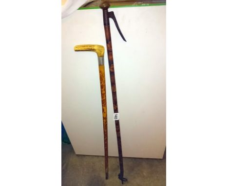 A late 19th / early 20th century bamboo walking stick litter picker by C Harris Leicester and a horn handled walking stick