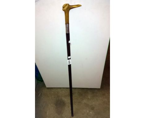 A walking stick with antler handle and silver collar