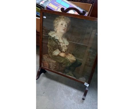 A fire screen with Bubbles picture inset