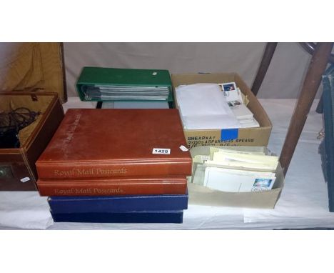 A large collection of stamps including albums, first day covers, postcards etc