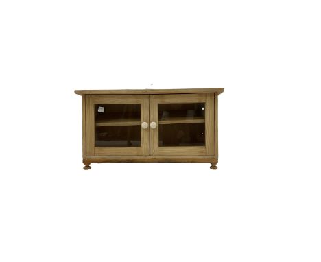 Striped pine kitchen cupboard, two glazed doors enclosing single shelf, on compressed bun feetDimensions: Height:&nbsp;47cm&n