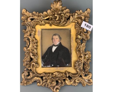 A gilt framed early 19th Century hand painted portrait of a gentleman on what appears to be milk glass backed onto marble, fr