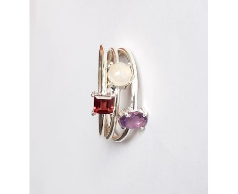 Three 925 silver stacking rings set with opal, amethyst and garnet, (S).