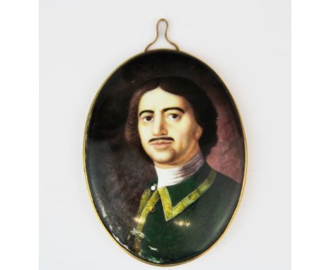 A gilt metal mounted hand painted portrait miniature enamel on copper of an Italian gentleman, L. 10cm.