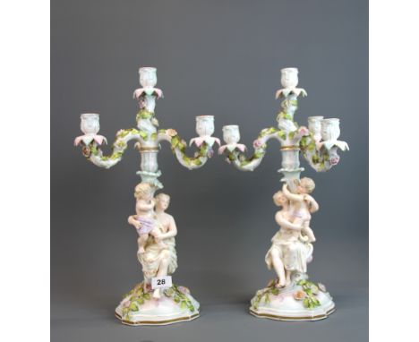 A pair of 19th century German porcelain candelabra, H. 48cm.