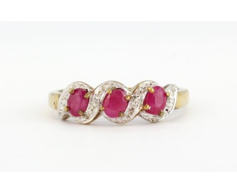 A 9ct yellow gold ruby and diamond set ring, (N).