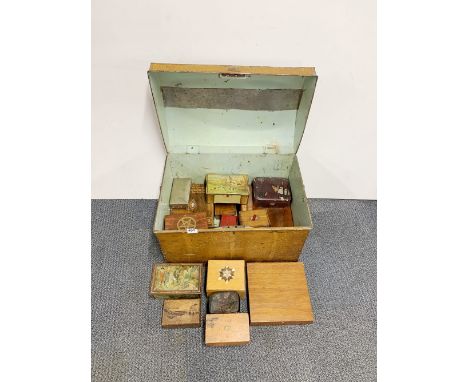 A tin trunk containing a quantity of wooden boxes and mixed tins.