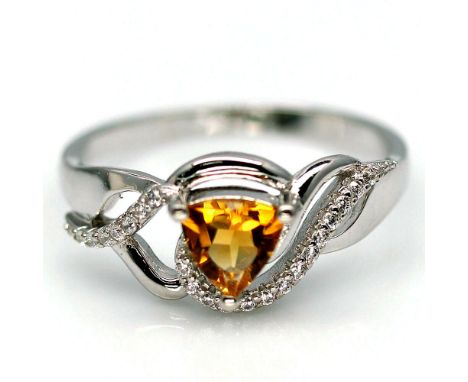 A 925 silver ring set with a trillion cut citrine and white stones, (R.5).