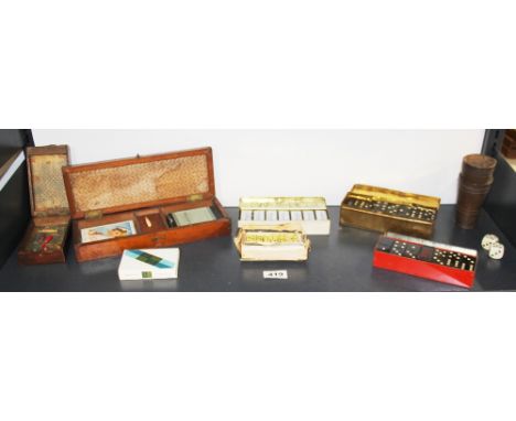 A group of advertising domino sets together with cribbage boards.