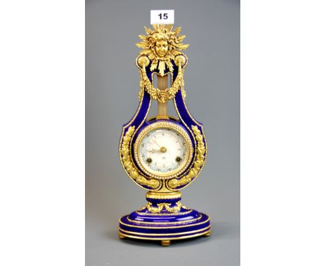 A Franklin Mint Marie Antoinette mantle clock by The Victoria and Albert Museum with key, H. 39cm.