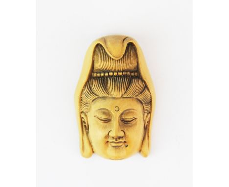 A small signed carved fruitwood netsuke of the goddess Guanyin, H. 5cm.