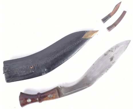 A vintage Nepalese Gurkha Regiment military Kukri knife with British ordnance stamp to the ricasso. The knife of typical form