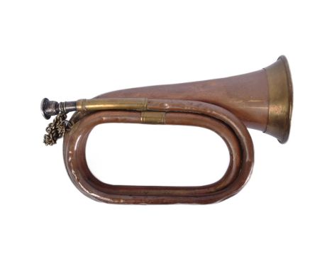 A WWI First World War British Infantry bugle. Typical form of copper construction with brass banding. Measures approx 28cm.