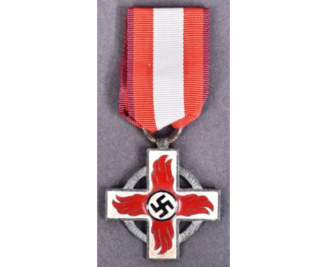 A WWII Second World War Third Reich Nazi German Officers Fire Brigade Cross medal. Red and white enamel cross with central bl