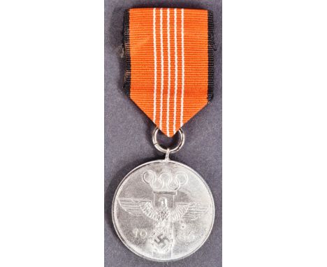 A WWII Second World War Third Reich Nazi German 1936 Berlin Olympics civil decoration medal. The medal with German Eagle and 