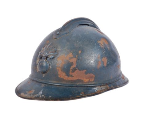 A WWI First World War period French Infantry M15 steel combat Adrian helmet. Steel construction with split pin ' comb ' and '