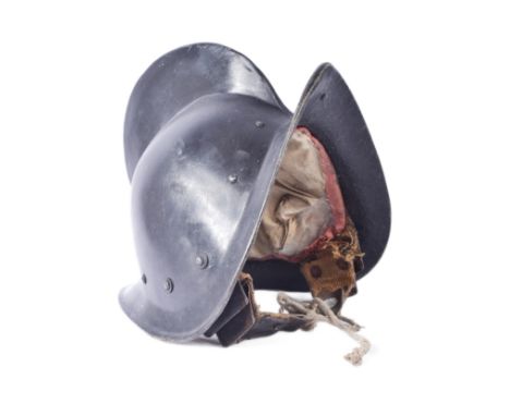 A vintage 20th Century replica of a medieval style Spanish Morion / Pikemans pot helmet. Black fibre glass construction with 