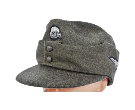 A replica WWII Second World War Third Reich Nazi German Heer / Waffen SS M43 Ski cap. Field grey wool construction with SS De