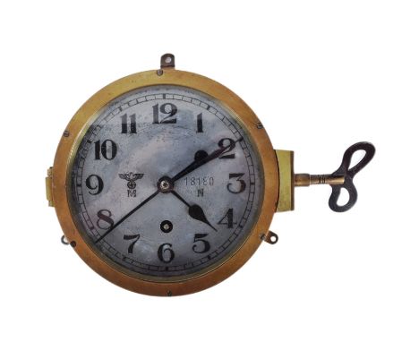 An original WWII Second World War Third Reich Nazi German Kriegsmarine U-Boat bulkhead clock. Arabic numerals, with Eagle Swa