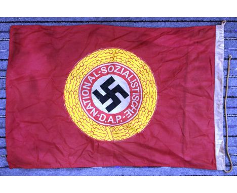 A WWII Second World War Third Reich Nazi German NSDAP flag. Red ground with a large circular patch sewn to opposing sides dep