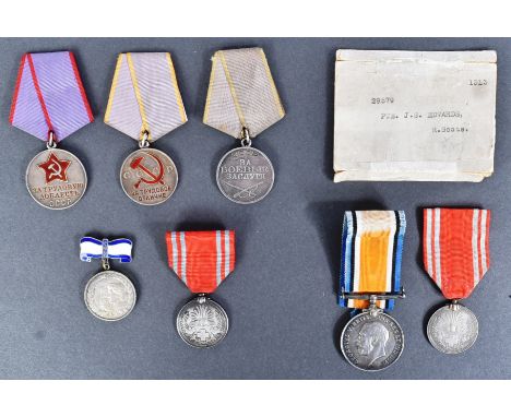 Medals - a collection of assorted unrelated medals and similar items to include: a WWI First World War medal to one 29579 Pri