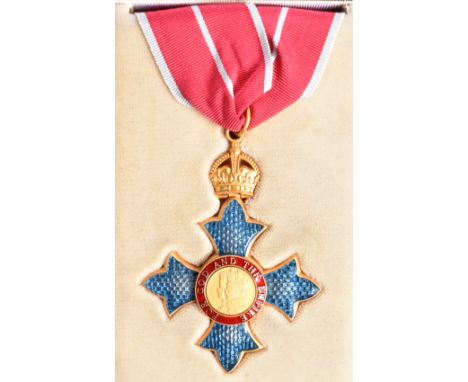 A Queen Elizabeth II CBE Commander Of The Order Of The British Empire medal. The front having a the monarchs profile ' For Go